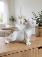 Glossy White Ceramic Puppy Figurine with Golden Accents
