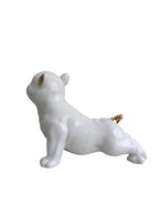 Glossy White Ceramic Puppy Figurine with Golden Accents